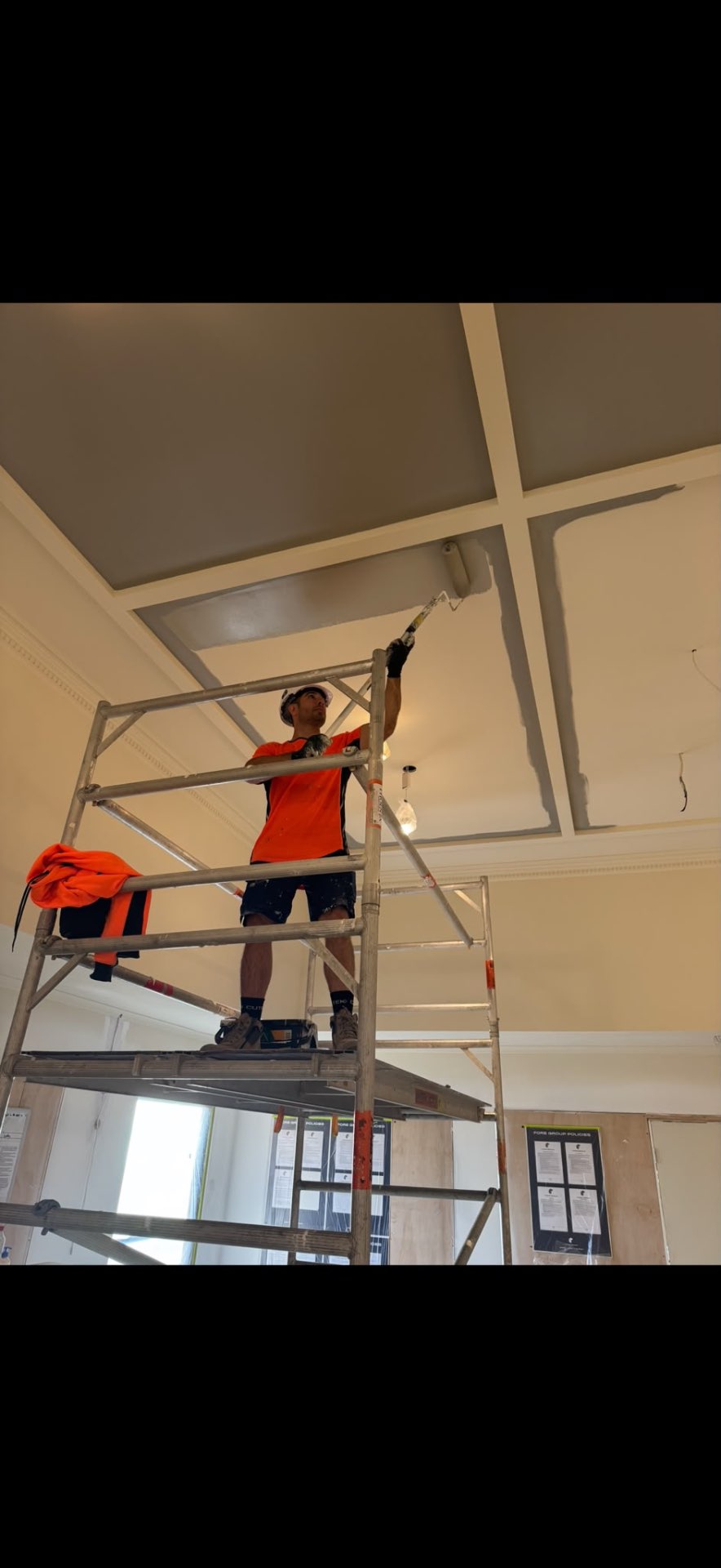 YTS PaintPro tradesman rolling paint onto a coffered ceiling