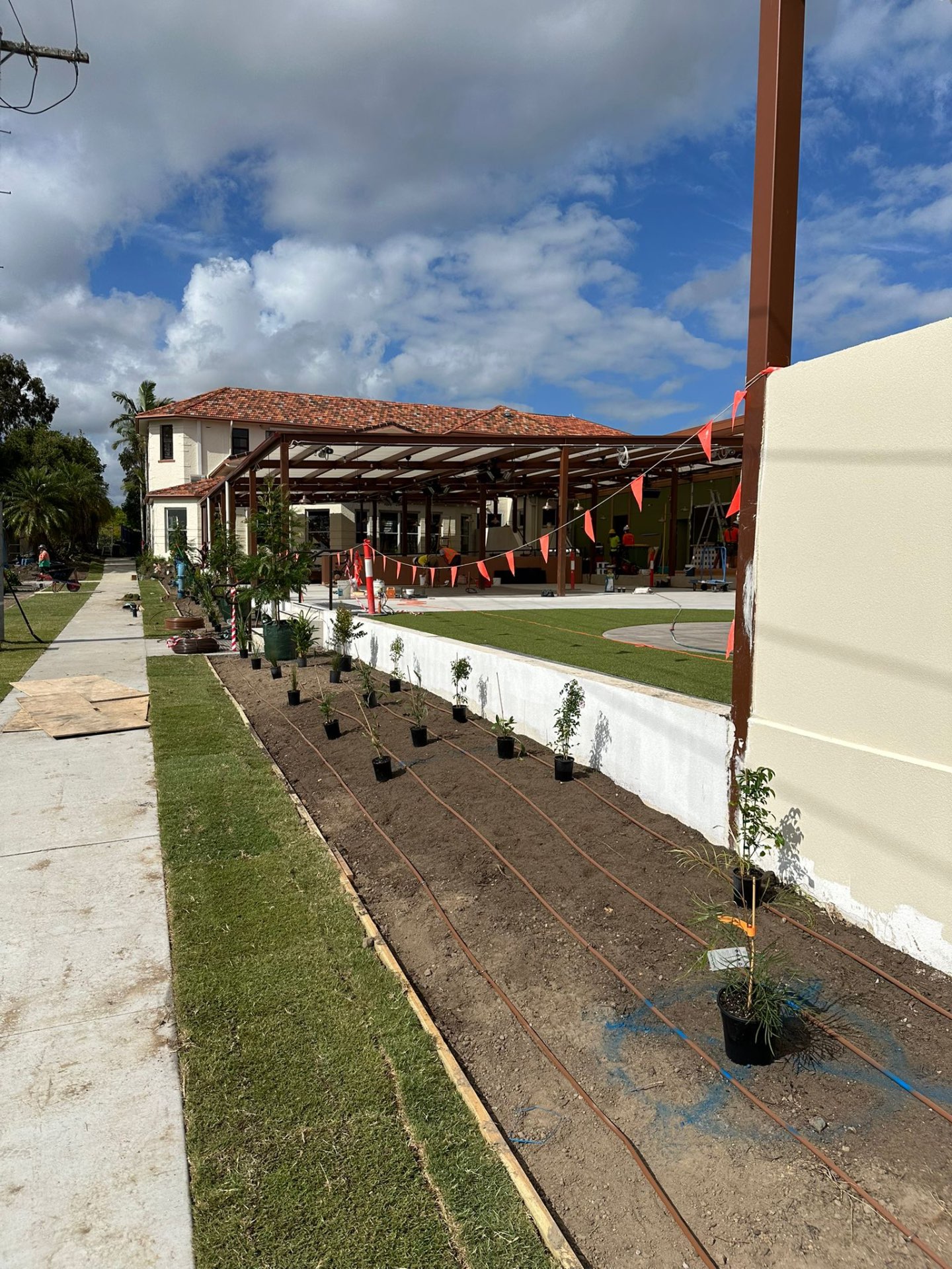 A cream-rendered Sunshine Coast exterior with tiled roof